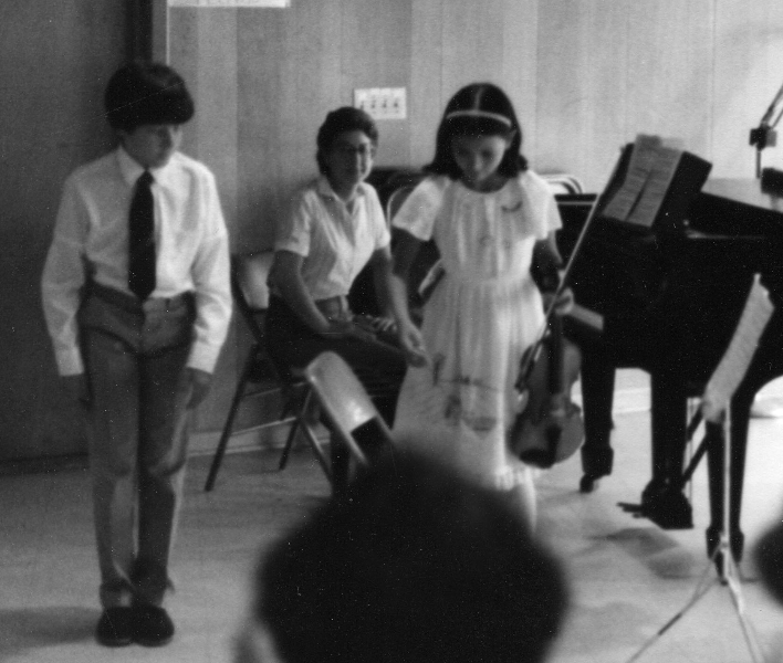 Claude Mottier bowing after concert at summer camp. Merrywood, Lenox MA, 1984