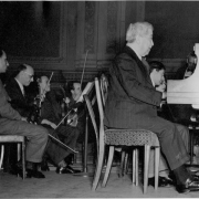 Artur Schnabel and son Karl Ulrich Schnabel at rehearsal of Bach, Concerto for 2 pianos and orchestra, C major, at Carnegie Hall, New York, February 1947. In background conductor Charles Adler.
