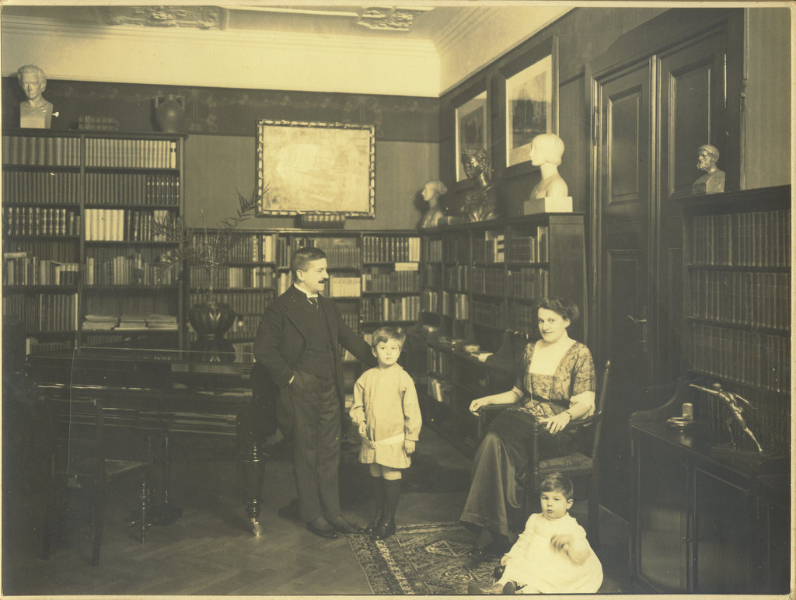 Artur, Karl Ulrich (standing), Therese, and Stefan (sitting) in library in Berlin (about 1913)