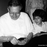 Karl Ulrich Schnabel opening gifts on his birthday, with his grandson Claude, West Hartford, 1984
